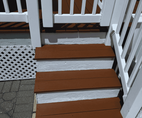 Detail of painted exterior stairs with smooth, durable finish in Sarasota.